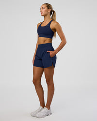 Woman wearing Challenger 5" Lined Performance Short - Future Navy | Model: Evie | Size:S | Thumbnail Index: 4