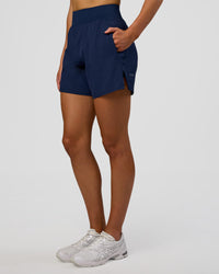 Woman wearing Challenger 5" Lined Performance Short - Future Navy | Model: Evie | Size:S | Thumbnail Index: 6
