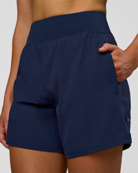 Woman wearing Challenger 5" Lined Performance Short - Future Navy | Model: Evie | Size:S | Thumbnail Index: 5