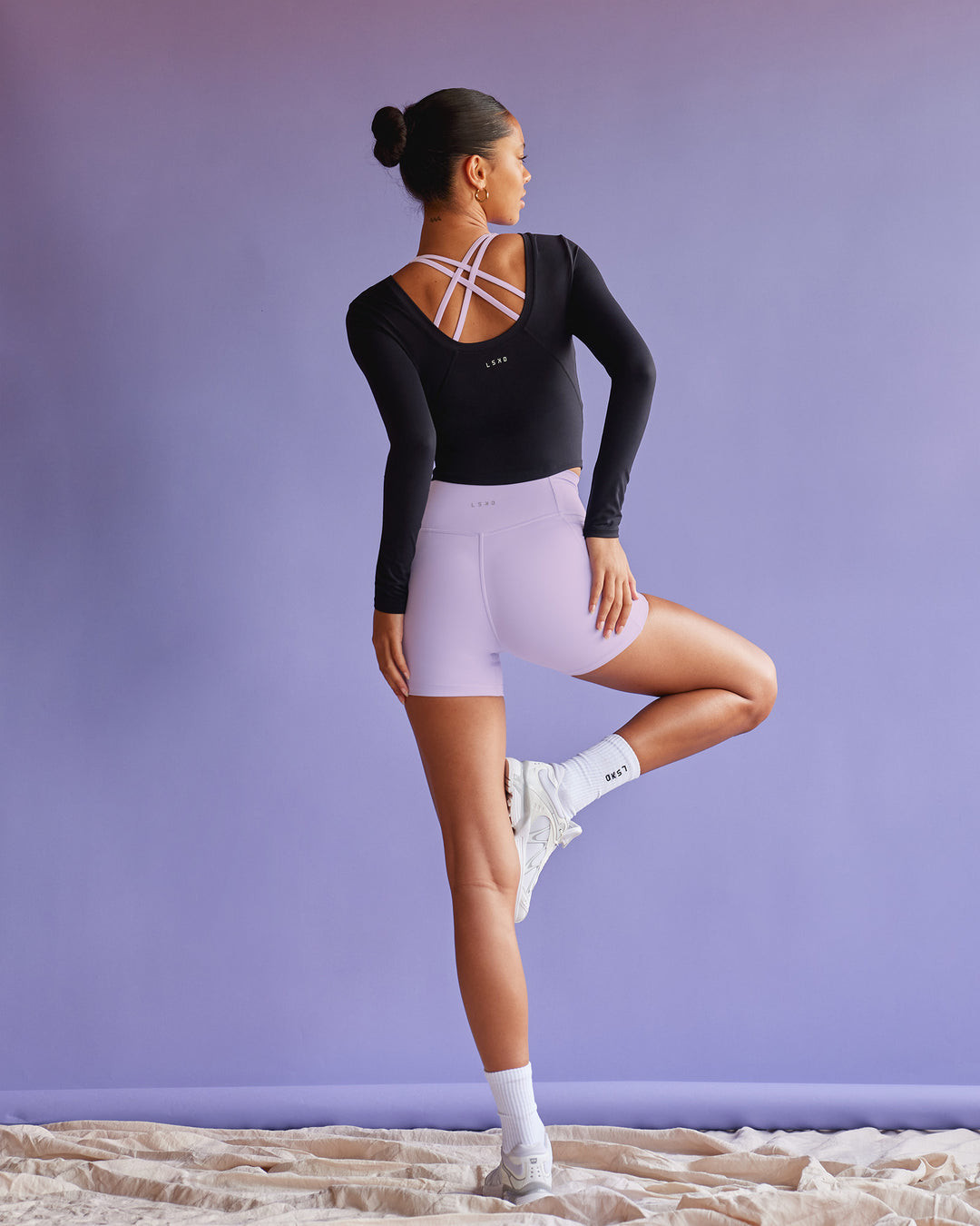 Woman wearing Effortless Long Sleeve Top - Black | Model:Tali | Size:S - view 1