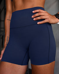 Woman wearing Elixir Ultra High-Rise 4" Short Pockets - Future Navy | Model:Chyna | Size:S | Thumbnail Index: 5