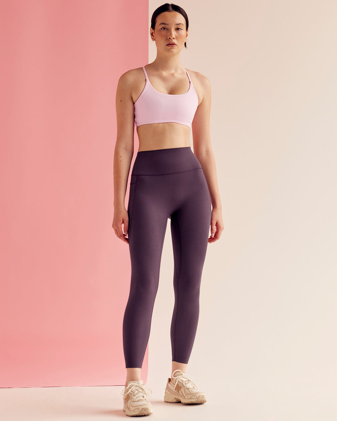 Woman wearing Elixir Ultra High-Rise 7/8 Legging Pockets - Midnight Plum | Model:Paradise | Size:S - view 4