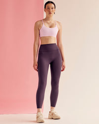 Woman wearing Elixir Ultra High-Rise 7/8 Legging Pockets - Midnight Plum | Model:Paradise | Size:S | Thumbnail Index: 3