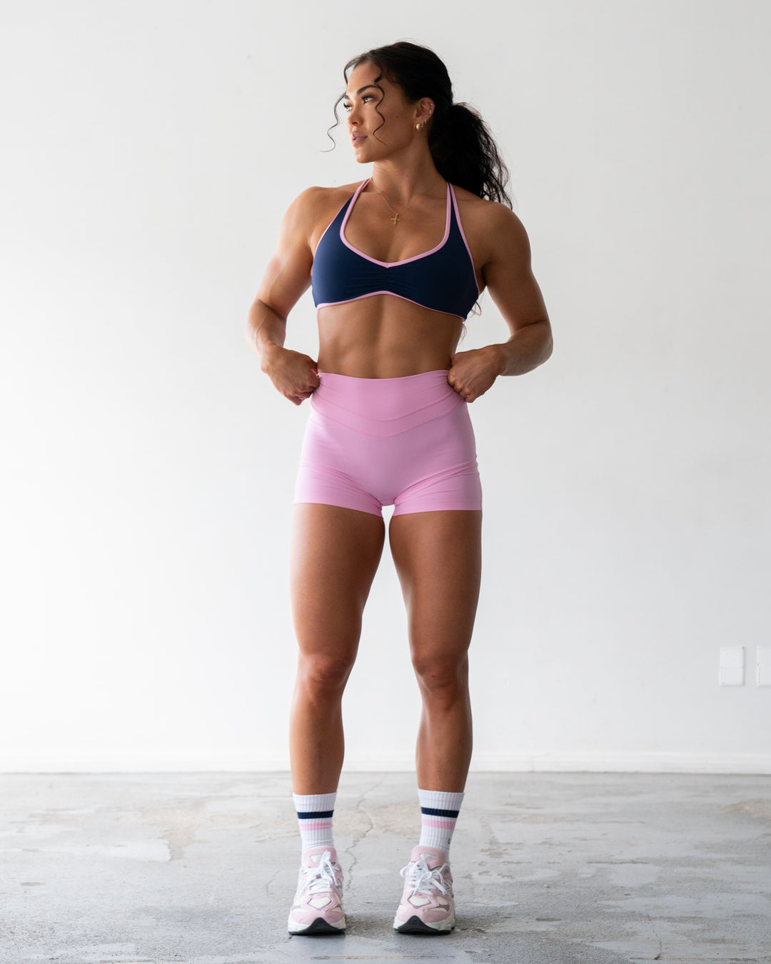 Woman wearing Enhance Ultra High-Rise 4" Short - Pink Frosting | Model:Emily | Size:S - view 1