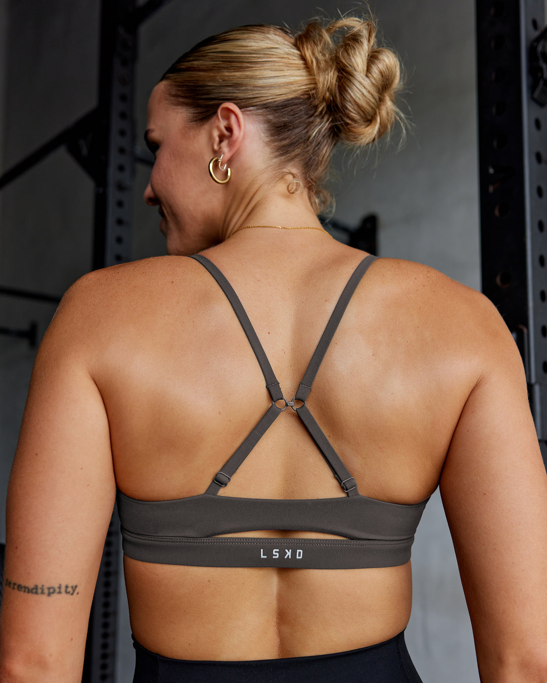 Woman wearing Essence Sports Bra - Dark Storm | Model:Shae | Size:S - view 2