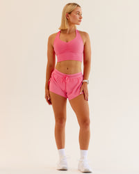 Woman wearing Evoke Sports Bra in Pink Lemonade | Size:S | Thumbnail Index: 0