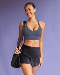 Woman wearing Flash Longline Sports Bra - Night Shadow | Model:Tali | Size:S | Thumbnail Index: 1