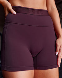 Woman wearing Fusion Jacquard High-Rise 4” Short Pockets - Cherry Lacquer | Model:Iris | Size:S | Thumbnail Index: 0