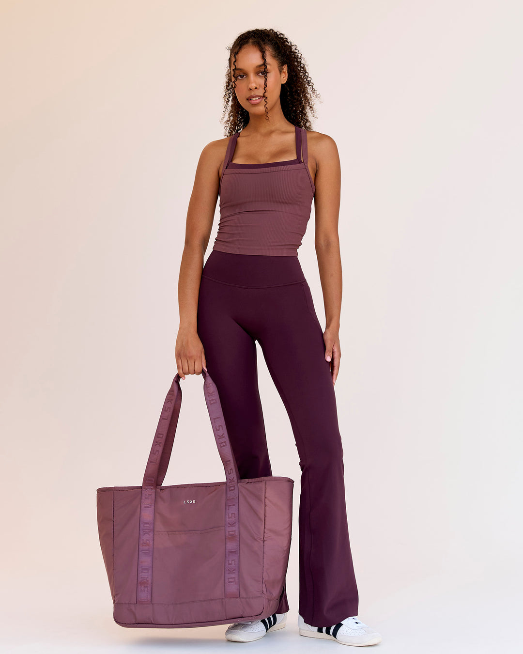 Woman wearing Fusion V-Contour High-Rise Flared Legging Pockets - Cherry Lacquer | Model:Jordan | Size:S - view 3