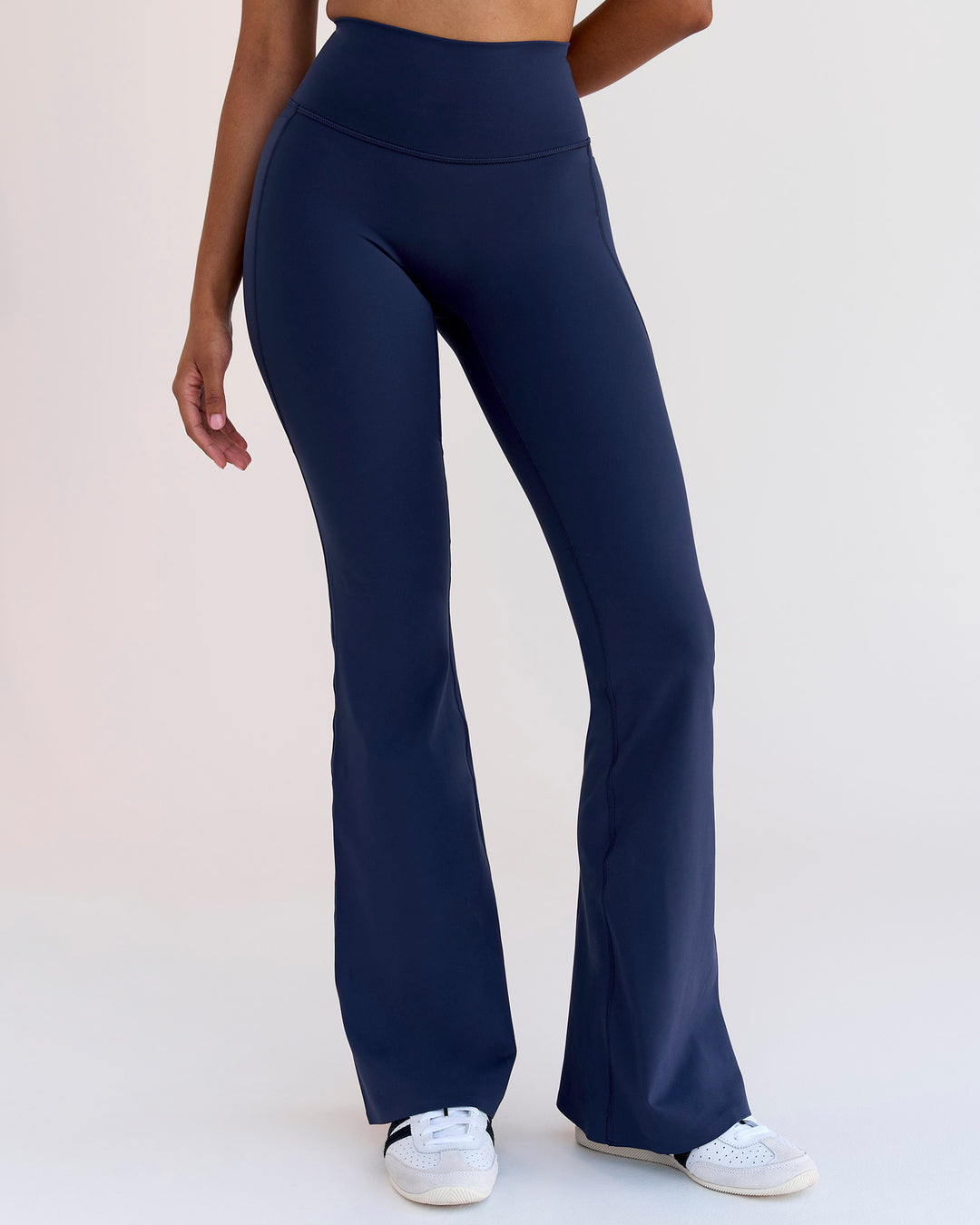 Woman wearing Fusion V-Contour High-Rise Flared Legging Pockets - Future Navy | Model:Jordan | Size:S - view 1
