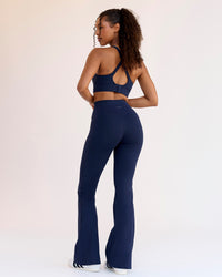 Woman wearing Fusion V-Contour High-Rise Flared Legging Pockets - Future Navy | Model:Jordan | Size:S | Thumbnail Index: 1