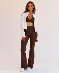 Woman wearing Woman wearing Fusion V-Contour High-Rise Flared Legging Pockets - Hot Chocolate | Model:Jordan | Size:S | Thumbnail Index: 4