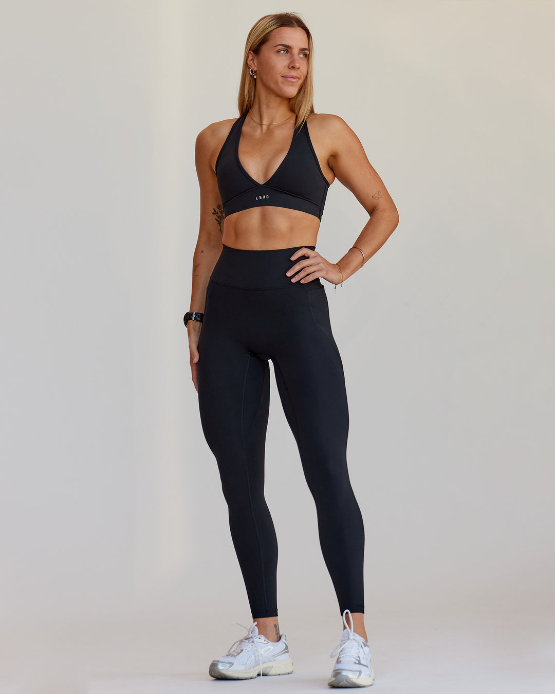 Woman wearing Fusion V-Contour Ultra High-Rise Full Length Legging Pockets - Black | Model:Shae | Size:S - view 1