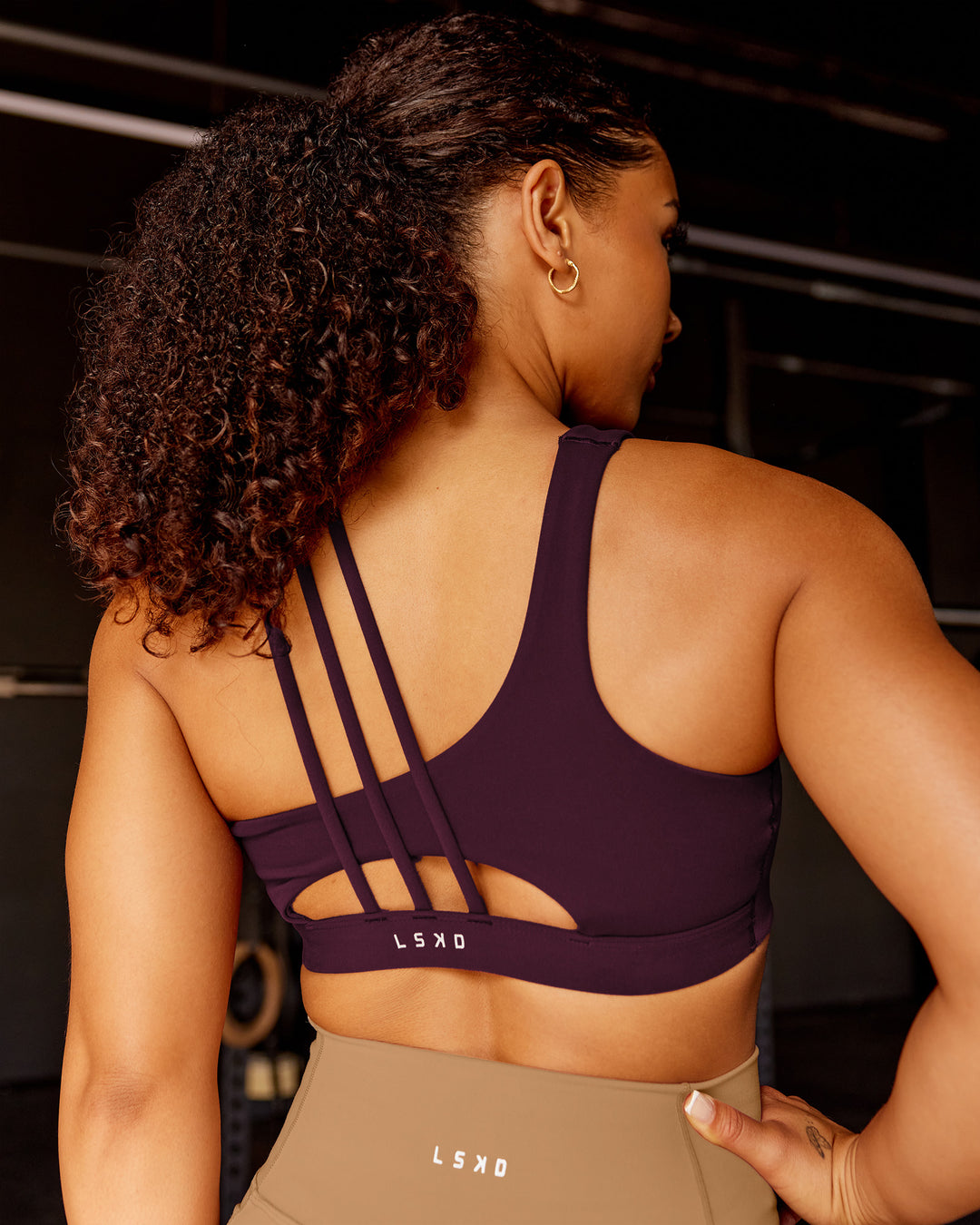 Woman wearing Galvanise Sports Bra 2.0 - Cherry Lacquer | Model:Tarnie | Size:S - view 2