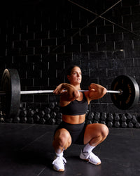 Woman wearing Genesis Layered Sports Bra - Black | Size:S | Thumbnail Index: 3