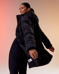 Woman wearing Go-To Puffer Long Jacket - Black | Model:Rhiley | Size:S | Thumbnail Index: 4