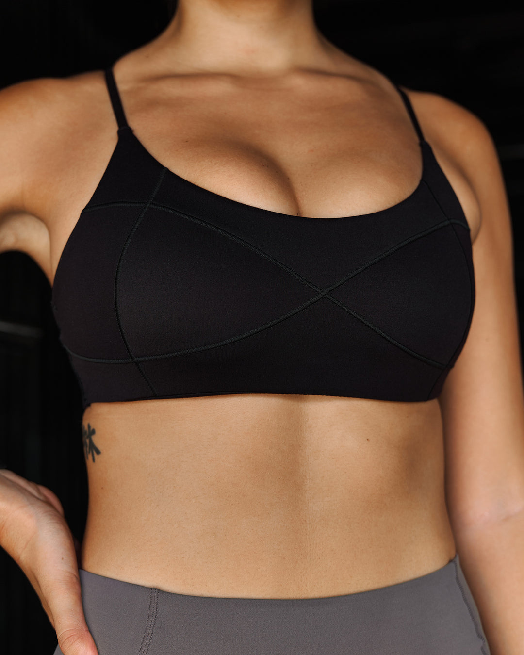 Woman wearing Infinite Contour Sports Bra - Black | Model:Stella | Size:S - view 5