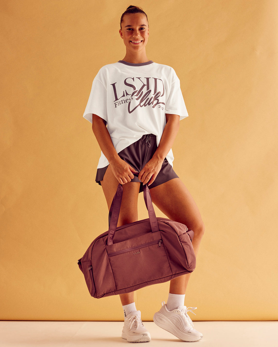 Woman wearing LSKD Fitness Club Heavyweight Oversized Tee - Off White-Cocoa Powder | Model:Charlize | Size:S - view 4