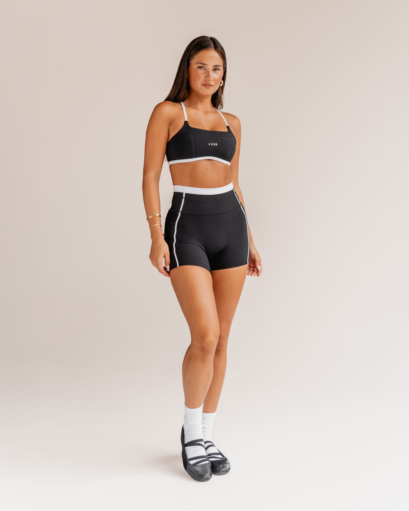 Woman wearing Liberate Contrast High-Rise 4" Short Pockets - Black-White | Model:Bianca | Size:S