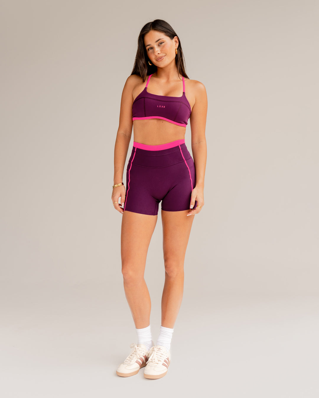Woman wearing Liberate Contrast High-Rise 4" Short Pockets - Plum Caspia-Ultra Pink | Model:Jordi | Size:S - view 2