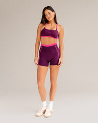 Woman wearing Liberate Contrast High-Rise 4" Short Pockets - Plum Caspia-Ultra Pink | Model:Jordi | Size:S | Thumbnail Index: 1