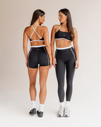 Woman wearing Liberate Sports Bra - Black-White | Model:Both | Size:S | Thumbnail Index: 1