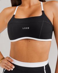 Woman wearing Liberate Sports Bra - Black-White | Model:Jordi | Size:S | Thumbnail Index: 2