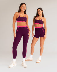 Woman wearing Liberate Sports Bra - Plum Caspia-Ultra Pink | Model:Both | Size:S | Thumbnail Index: 3