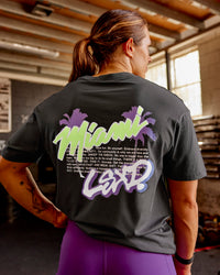 Woman wearing Miami Snatch FLXCotton Oversized Tee - Dark Storm-Marshmallow | Model:Gracie | Size:S | Thumbnail Index: 4