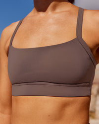 Woman wearing Momentum Sports Bra - Peppercorn | Model:Rica | Size:S | Thumbnail Index: 0