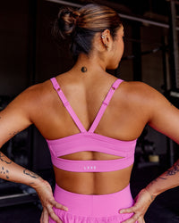 Woman wearing Momentum Sports Bra - Ultra Fuchsia | Model:Beccie | Size:S | Thumbnail Index: 1