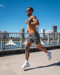 Man wearing Pace 5" Lined Running Short - Markings Dark Storm Print | Model:Tommy | Size:S | Thumbnail Index: 1