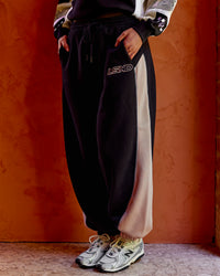 Woman wearing Power Play Stitch Up Fleece Sweat Pant - Black-Shale Beige | Model:Shae | Size:S | Thumbnail Index: 6