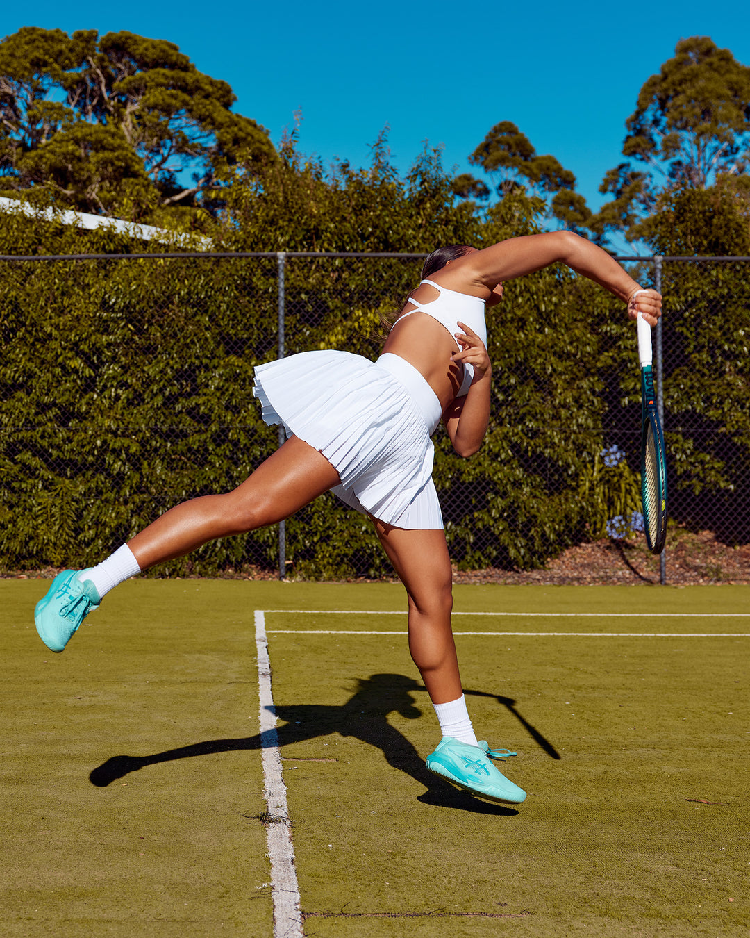 Woman wearing Precision Active Skirt - White | Model:Laquisa | Size:S - view 1