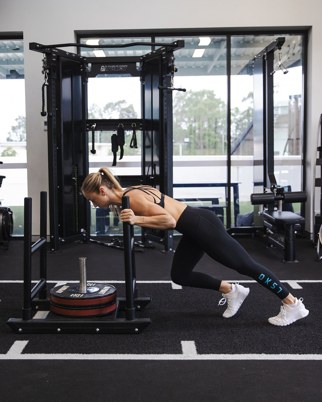 Woman wearing Rep Ultra High-Rise 7/8 Legging Pockets - Black-Retro Blue | Model:Bronte | Size:S - view 5