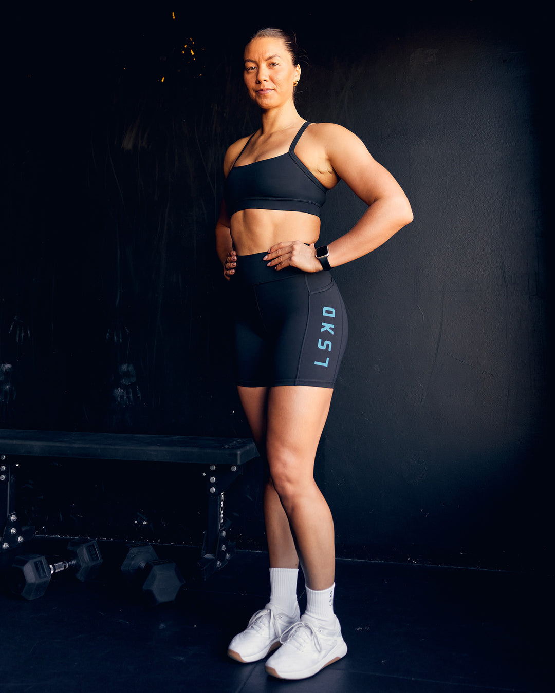 Woman wearing Rep Ultra High-Rise 6" Short Pockets - Black-Blue Atoll | Model:Bailey | Size:S - view 2