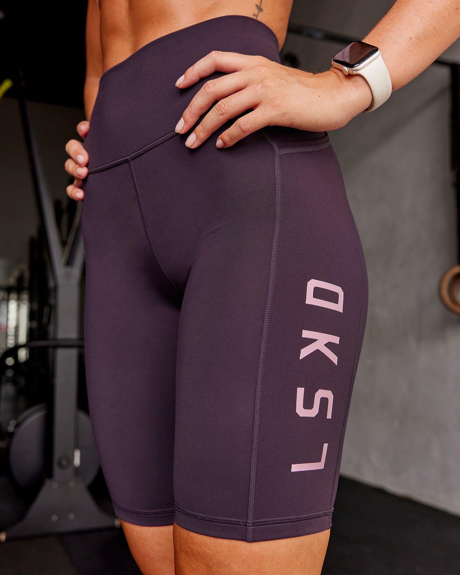 Woman wearing Rep Ultra High-Rise 9" Short Pockets - Midnight Plum-Marshmallow | Model:Roisin | Size:S