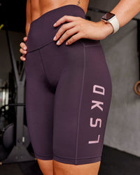 Woman wearing Rep Ultra High-Rise 9" Short Pockets - Midnight Plum-Marshmallow | Model:Roisin | Size:S | Thumbnail Index: 1