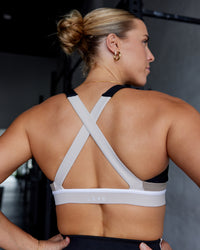 Woman wearing Revitalise Sports Bra - Black-Multi | Model:Shae | Size:S | Thumbnail Index: 5