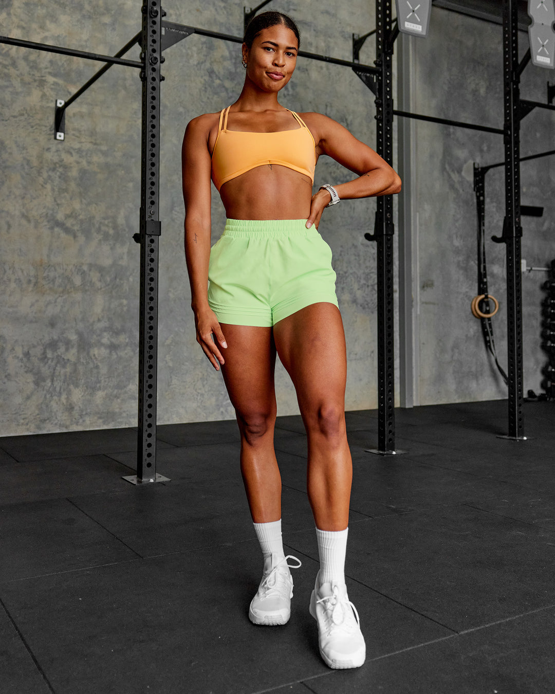 Woman wearing Sport Short 2.5" - Solar Lime | Model:Janet | Size:S - view 3