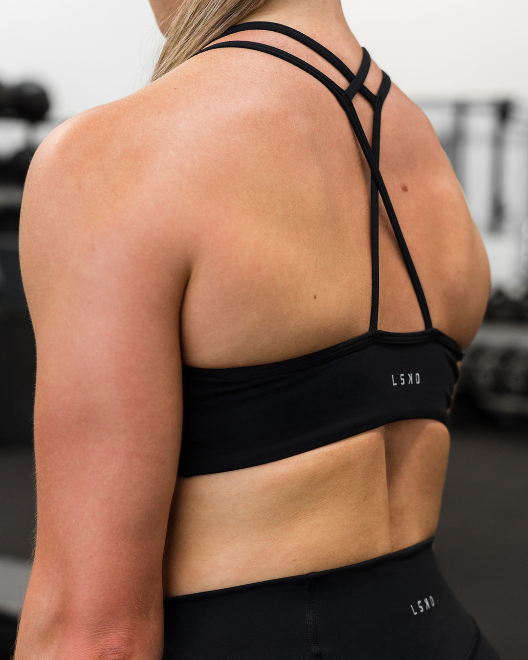 Woman wearing Stamina Pulse Sports Bra - Black | Model:Sarah | Size:S - view 13