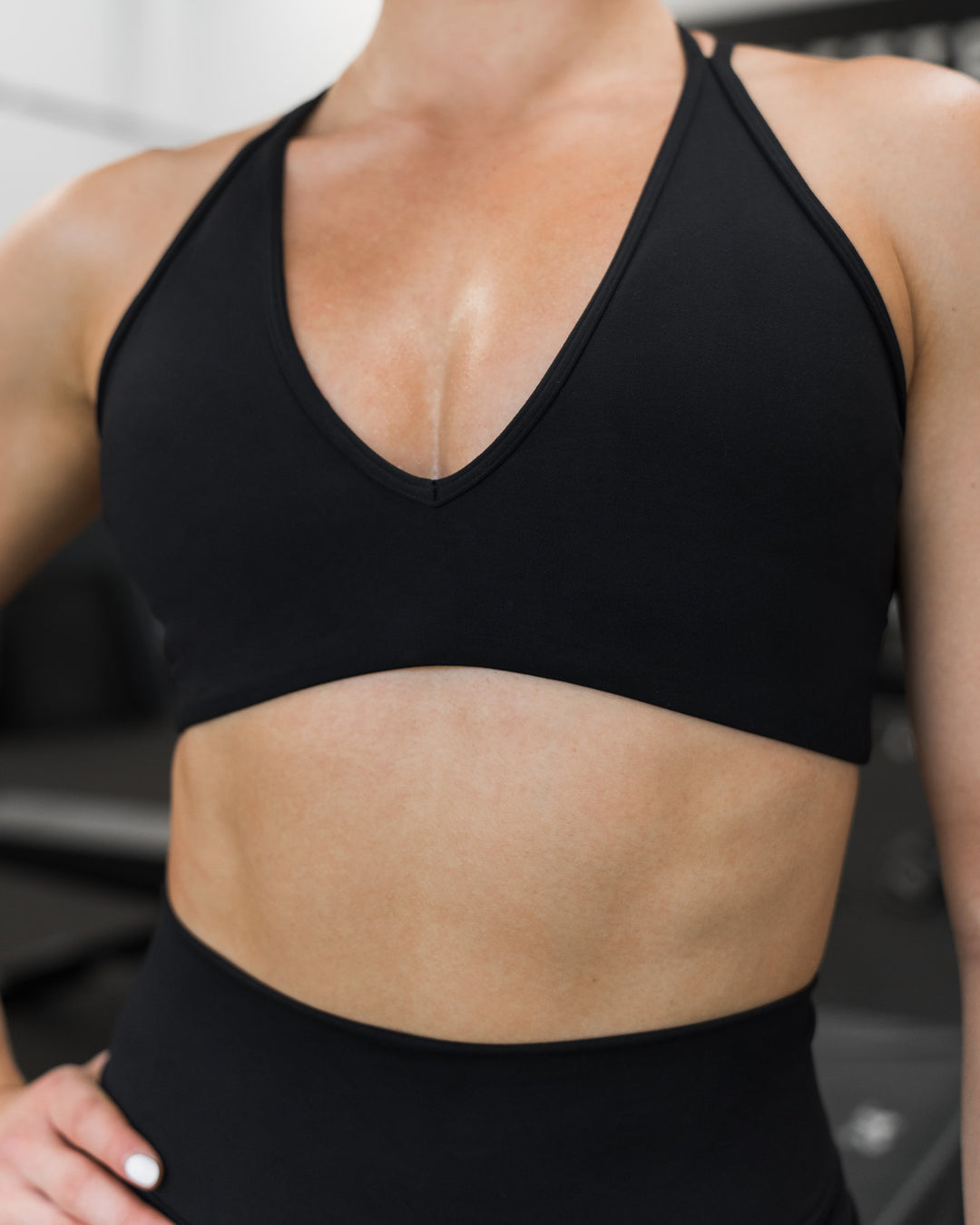 Woman wearing Stamina Pulse Sports Bra - Black | Model:Sarah | Size:S - view 10