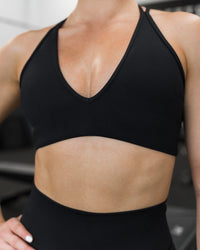 Woman wearing Stamina Pulse Sports Bra - Black | Model:Sarah | Size:S | Thumbnail Index: 9