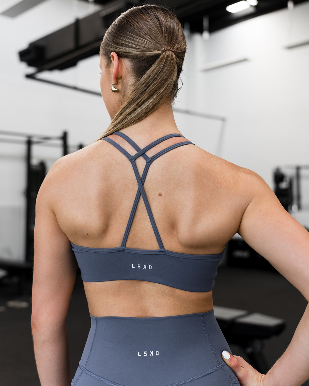 Woman wearing Stamina Pulse Sports Bra - Night Shadow | Model:Sarah | Size:S - view 12