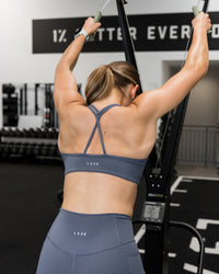 Woman wearing Stamina Pulse Sports Bra - Night Shadow | Model:Sarah | Size:S | Thumbnail Index: 7