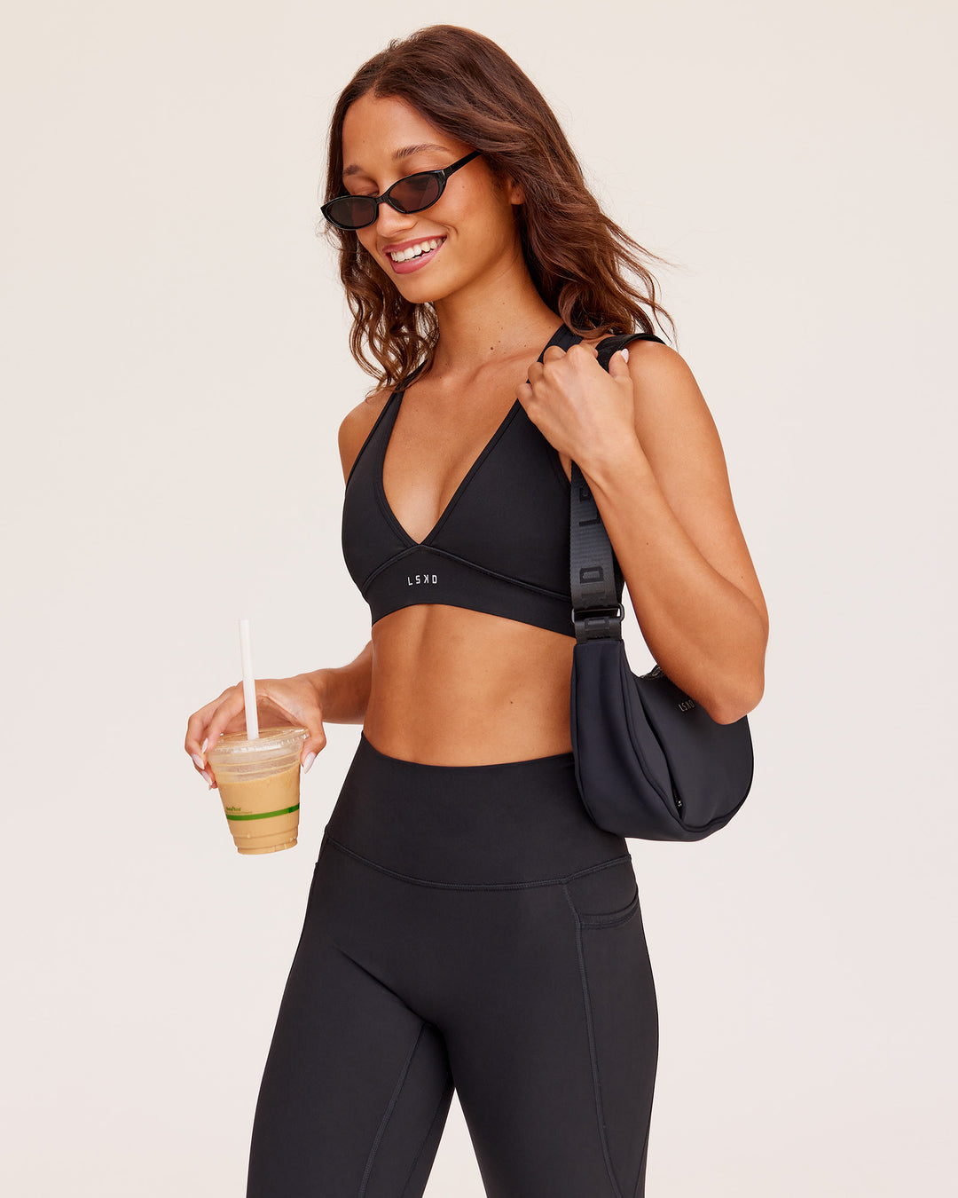 Woman wearing Stamina Sports Bra - Black | Model:Dakota | Size:S - view 1