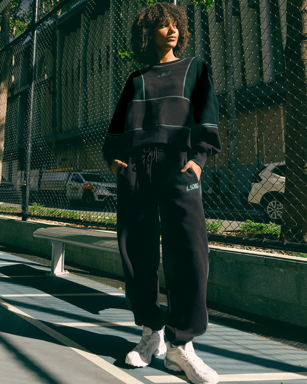 Woman wearing Stitch Up Fleece Sweat Pant - Black/Dark Moss | Model:Tomi | Size:S - view 4