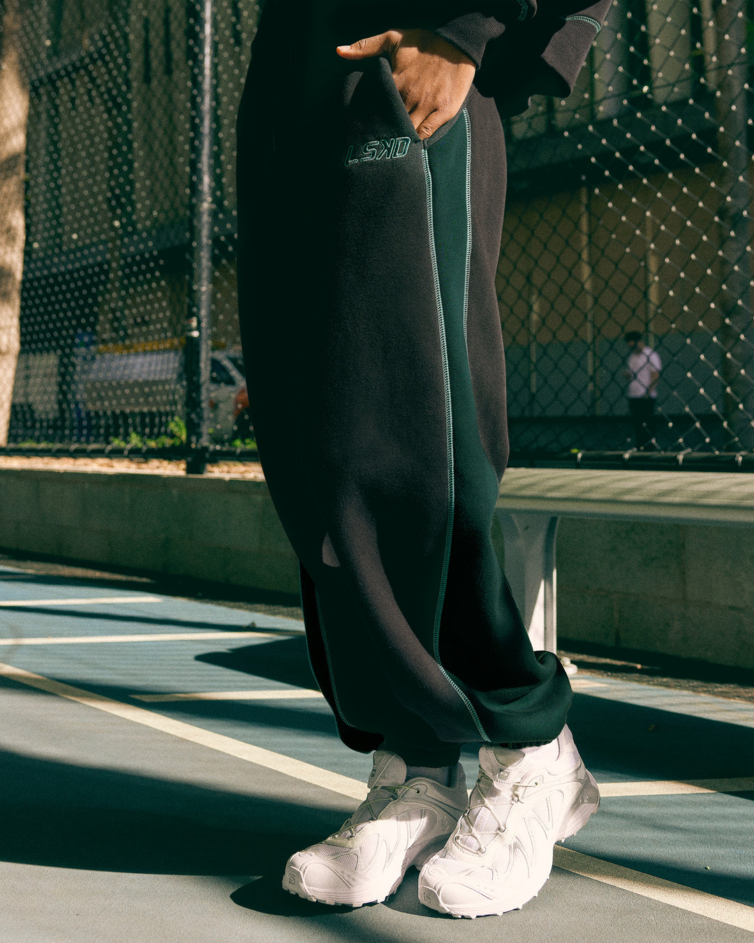 Woman wearing Stitch Up Fleece Sweat Pant - Black/Dark Moss | Model:Tomi | Size:S - view 1