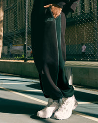 Woman wearing Stitch Up Fleece Sweat Pant - Black/Dark Moss | Model:Tomi | Size:S | Thumbnail Index: 0