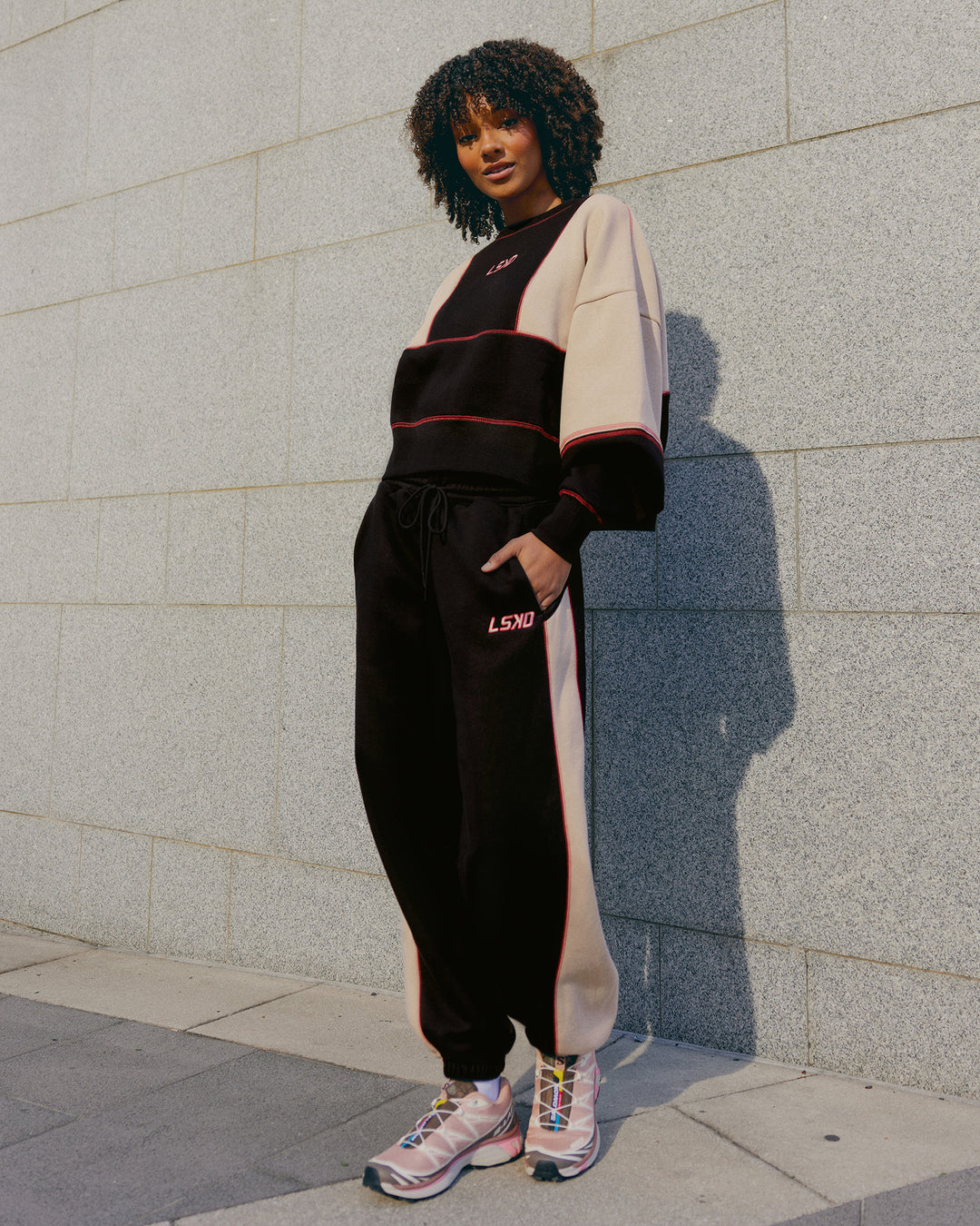 Woman wearing Stitch Up Fleece Sweat Pant - Black/Shale Beige | Model:Tomi | Size:S - view 2